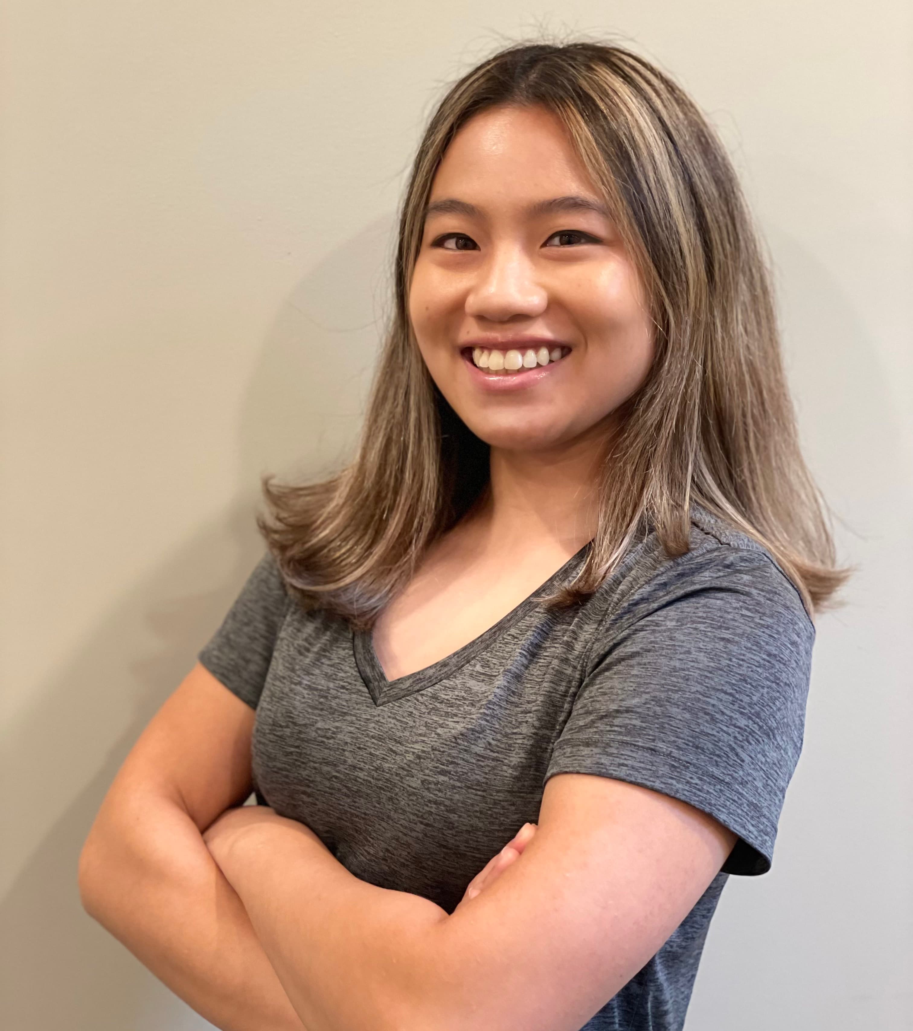 Darlene smiling with arms crossed